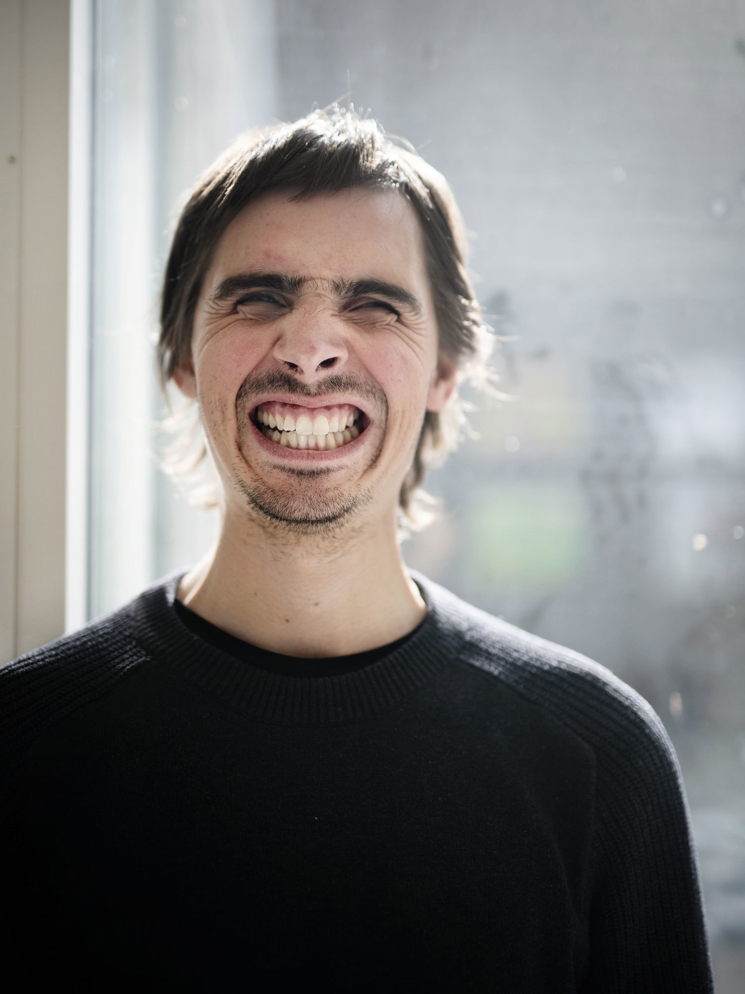 Portrait of Thomas Tvedt with a huge smile.