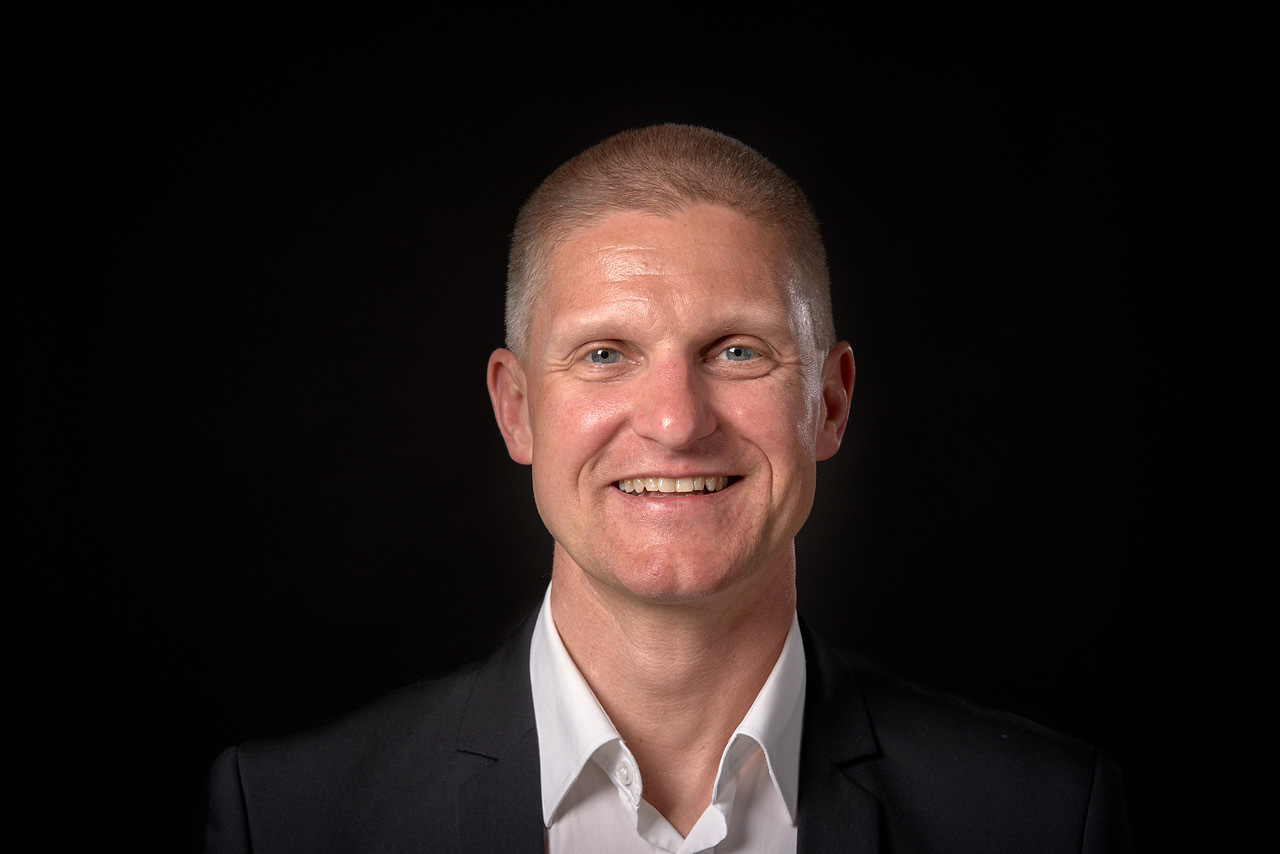 Portrett av Jo Asgeir Lie som smiler.