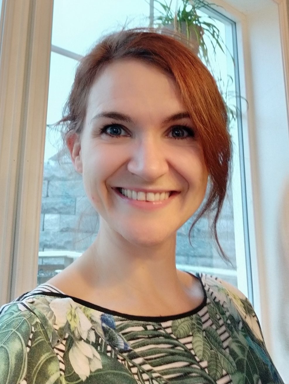 Portrett av Runa Bosnes Engen som smiler.