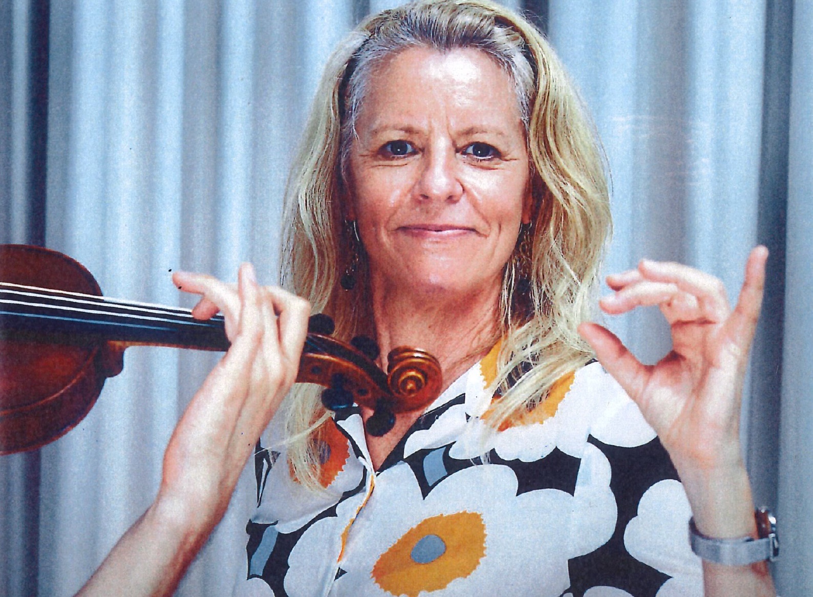 Woman showing correct hand posistion for a violinist
