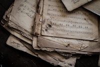 Old sheets of paper with musical notes written on them.