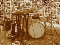 A drumset, two el-guitars and a synthesizer.